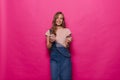 Portrait of happy smiling woman posing with credit card and mobile phone after online shopping Royalty Free Stock Photo