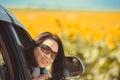 Portrait happy, smiling woman sitting in the car looking out windows, ready for vacation trip Royalty Free Stock Photo