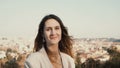 Portrait of happy smiling woman standing against the panorama of Rome, Italy. Female looking at camera, enjoying the day Royalty Free Stock Photo