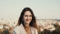 Portrait of happy smiling woman standing against the panorama of Rome, Italy. Female looking at camera, enjoying the day Royalty Free Stock Photo