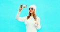 Portrait happy smiling woman taking selfie picture by smartphone Royalty Free Stock Photo