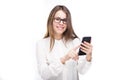 Portrait happy, smiling woman texting on her smart phone, isolated white background. Communication concept. Internet, phone addict Royalty Free Stock Photo