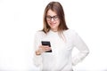 Portrait happy, smiling woman texting on her smart phone, isolated white background. Communication concept. Internet, phone addict Royalty Free Stock Photo