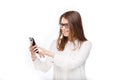 Portrait happy, smiling woman texting on her smart phone, isolated white background. Communication concept. Internet, phone addict Royalty Free Stock Photo