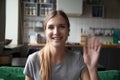 Portrait happy smiling woman waving hand, looking at camera Royalty Free Stock Photo