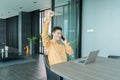 Portrait of happy smiling young business Asian, Chinese man person using laptop computer, working, and talking on smart mobile Royalty Free Stock Photo