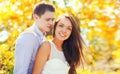 Portrait of happy smiling young couple together outdoors in sunny park Royalty Free Stock Photo