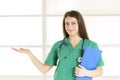 Portrait of happy smiling young female doctor showing blank area for text Royalty Free Stock Photo