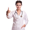 Portrait of happy smiling young female doctor showing blank signboard, with okay gesture, isolated over white Royalty Free Stock Photo