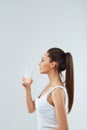 Portrait Of Happy Smiling Young Woman With Glass Of Fresh Water. Healthcare. Drinks. Health, Beauty, Diet Concept. Royalty Free Stock Photo