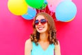 Portrait happy smiling young woman having fun over an air colorful balloons pink Royalty Free Stock Photo