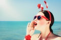 Portrait of a happy smiling young woman in Santa Claus hat Royalty Free Stock Photo