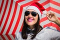 Portrait of a happy smiling young woman in Santa Claus hat Royalty Free Stock Photo