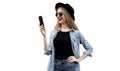 Portrait of happy smiling young woman with smartphone wearing black round hat isolated on white background Royalty Free Stock Photo