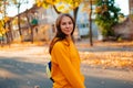 Portrait of a happy smiling young woman while walking outdoors Royalty Free Stock Photo