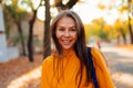 Portrait of a happy smiling young woman while walking outdoors Royalty Free Stock Photo