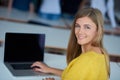 Portrait of happy smilling student girl at tech classroom