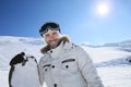 Portrait of a happy snowboarder on the slopes