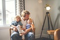Portrait of happy son and baby daughter with father at home Royalty Free Stock Photo