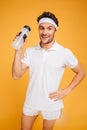 Portrait of a happy sports man holding bottle with water Royalty Free Stock Photo