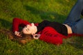 Portrait of happy sporty woman relaxing in park. Joyful female model breathing fresh air outdoors. Healthy active Royalty Free Stock Photo