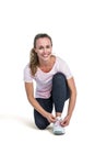 Portrait of happy sporty woman tying shoelace Royalty Free Stock Photo