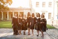 Portrait of happy students in graduation gowns Royalty Free Stock Photo