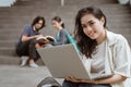 Portrait happy students holding laptops Royalty Free Stock Photo