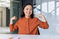 Portrait of happy successful Asian business woman, online meeting video call, woman looking at camera smiling and Royalty Free Stock Photo