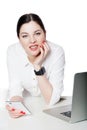 Portrait of happy successful attractive brunette businesswoman in white shirt sitting, holding her smartphone mobile, looking at Royalty Free Stock Photo