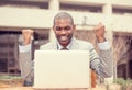 Portrait happy successful young man with laptop computer celebrates success Royalty Free Stock Photo