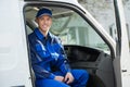 Portrait Of Happy Technician Sitting In Van Royalty Free Stock Photo