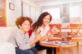 Happy teens playing card games in the living room Royalty Free Stock Photo