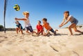 Boy making bump pass during beach volleyball game Royalty Free Stock Photo