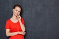 Portrait of happy thoughtful young woman imagining something in mind Royalty Free Stock Photo