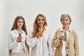 Portrait of happy three generations of women drink smoothies Royalty Free Stock Photo