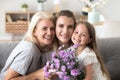 Portrait of happy three generations women family celebrating bir Royalty Free Stock Photo