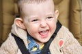 Portrait of a happy toddler baby boy in a stroller Royalty Free Stock Photo