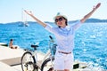 Young woman riding city bicycle near sea