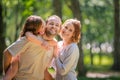 Portrait of a happy traditional family on walk in a summer park