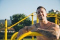 Portrait of a happy urban athlete with tattoos at the calisthenics gym Royalty Free Stock Photo