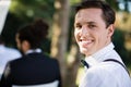 Portrait of happy waiter in park