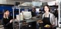 Portrait of happy waiter standing with order Royalty Free Stock Photo