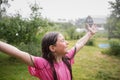 Portrait of happy wet child in rain in garden in hot summer. kids fun outroors on vacation. Royalty Free Stock Photo