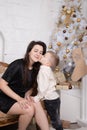 Portrait of happy woman and adorable baby boy celebrate Christmas. New Year& x27;s holidays. Toddler with mom in the Royalty Free Stock Photo