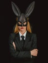 Portrait of a happy woman in bunny ears winking. Sexy blonde girl with lace bunny ears. Easter dinner menu. Sexy woman Royalty Free Stock Photo