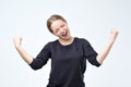 Portrait of happy woman celebrating winning in lottery or passing exam Royalty Free Stock Photo