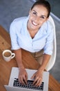 Portrait, happy woman and coffee with laptop in office for planning online research at desk from above. Employee, smile Royalty Free Stock Photo