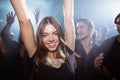 Portrait of happy woman dancing at nightclub Royalty Free Stock Photo