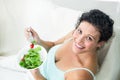 Portrait of happy woman eating salad Royalty Free Stock Photo